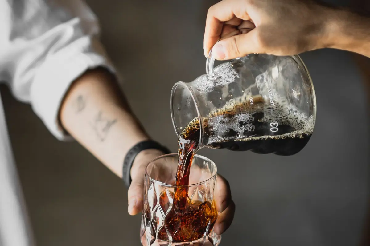 Cold brew coffee being poured over ice