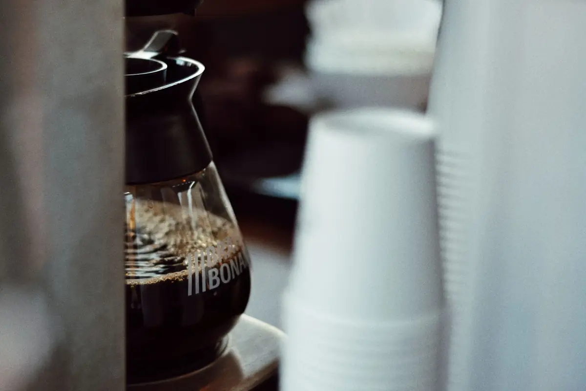 A glass coffee pot filled with fresh brewed coffee