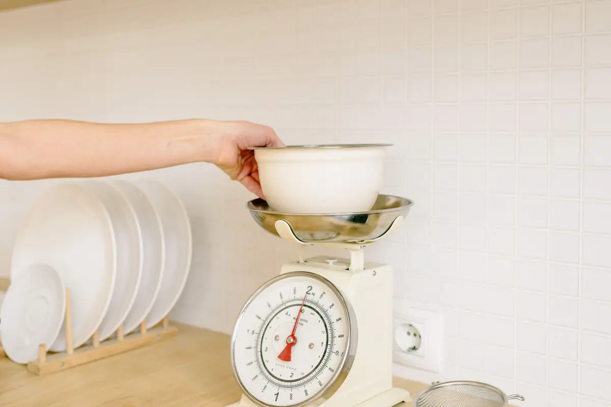 A mixing bowl sitting on a digital kitchen scale