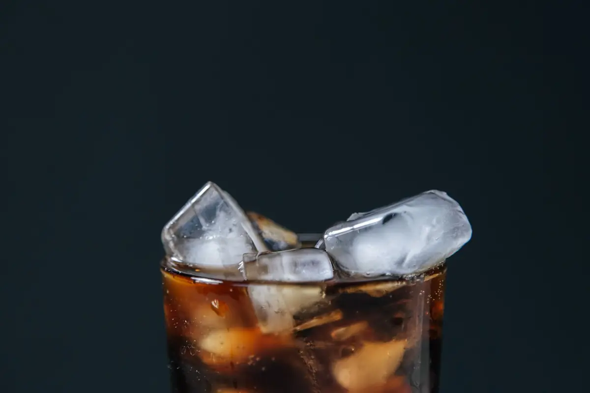 A glass of cola with ice