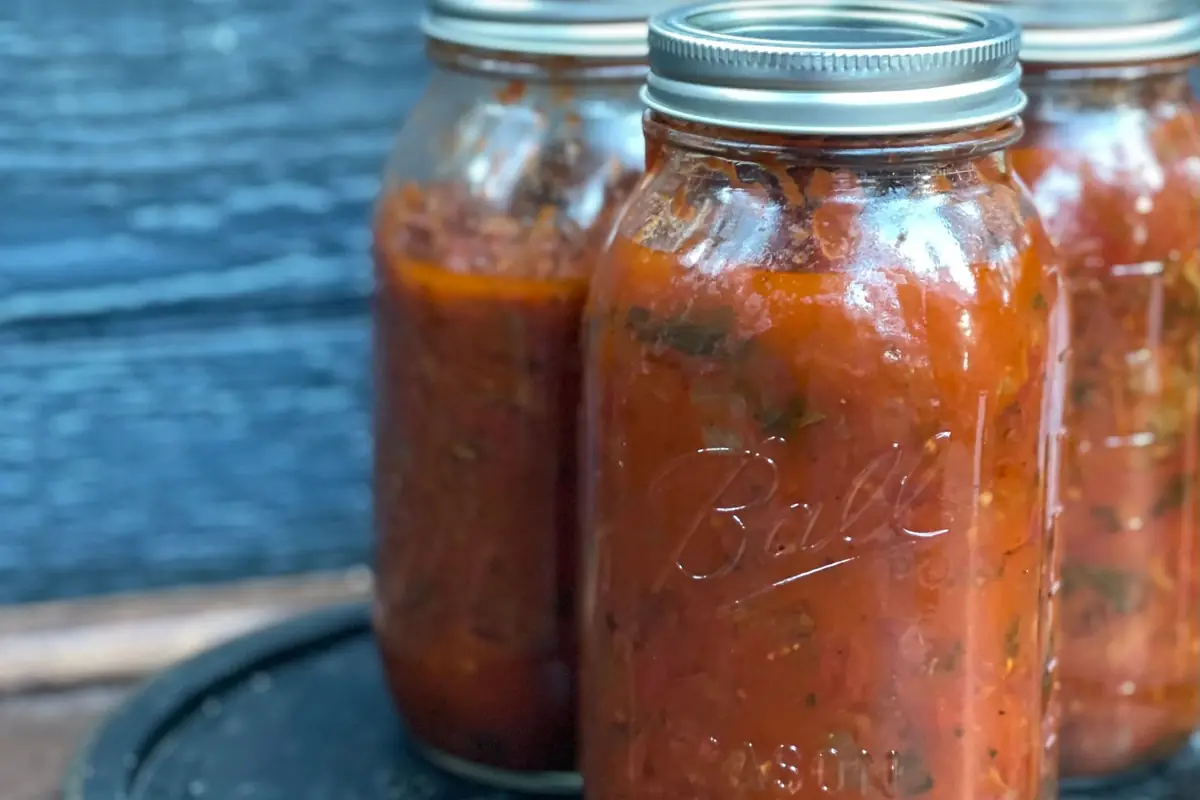 Mason jars of home-canned salsa