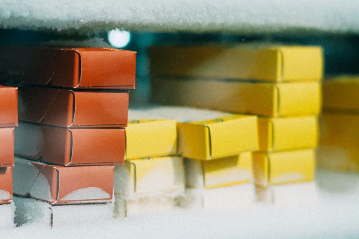 Boxes of frozen food covered in a layer of frost