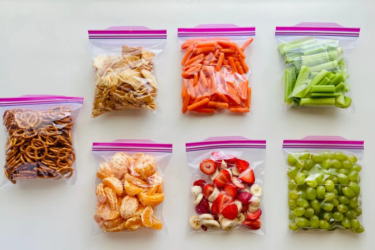 Fruits, vegetables and snacks portioned into sealed plastic bags