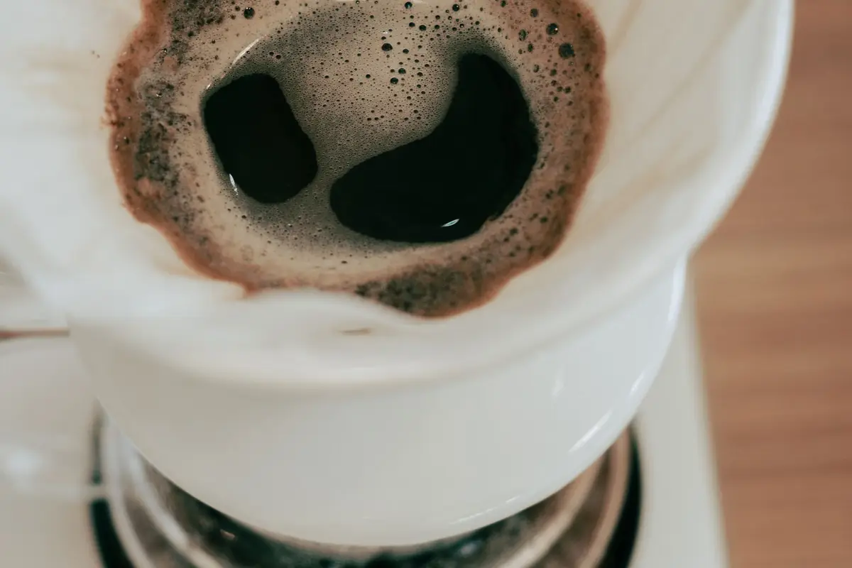 Coffee dripping through a paper filter