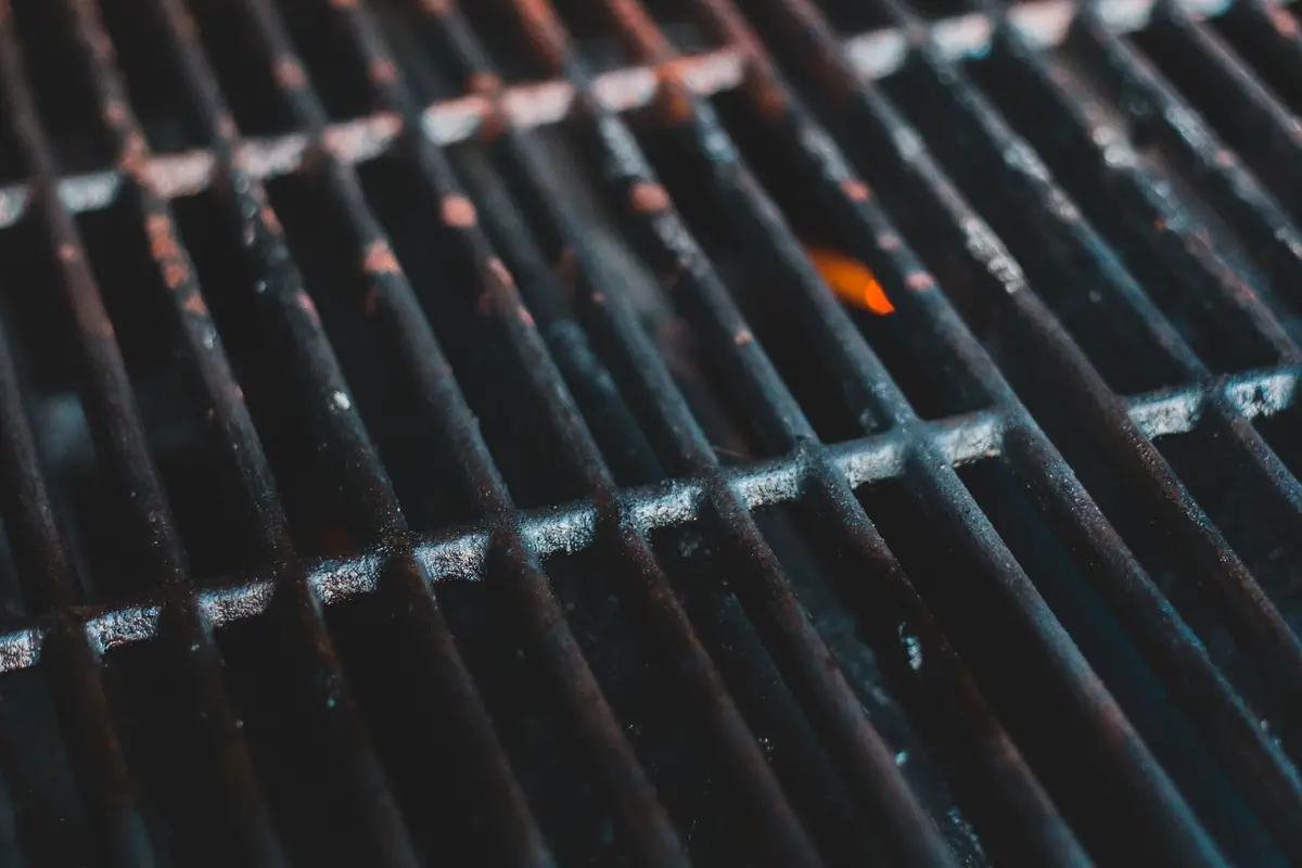 A close-up of a clean steel grill grate