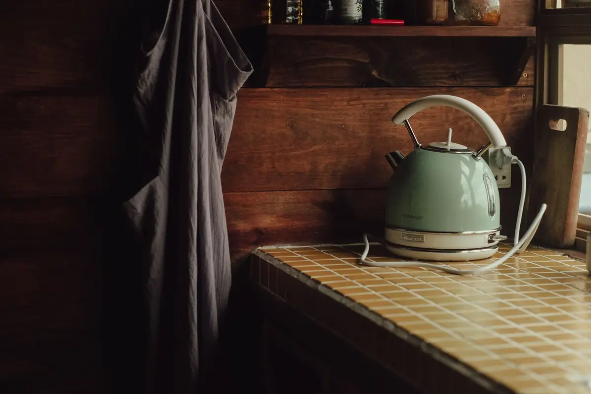A teal electric kettle