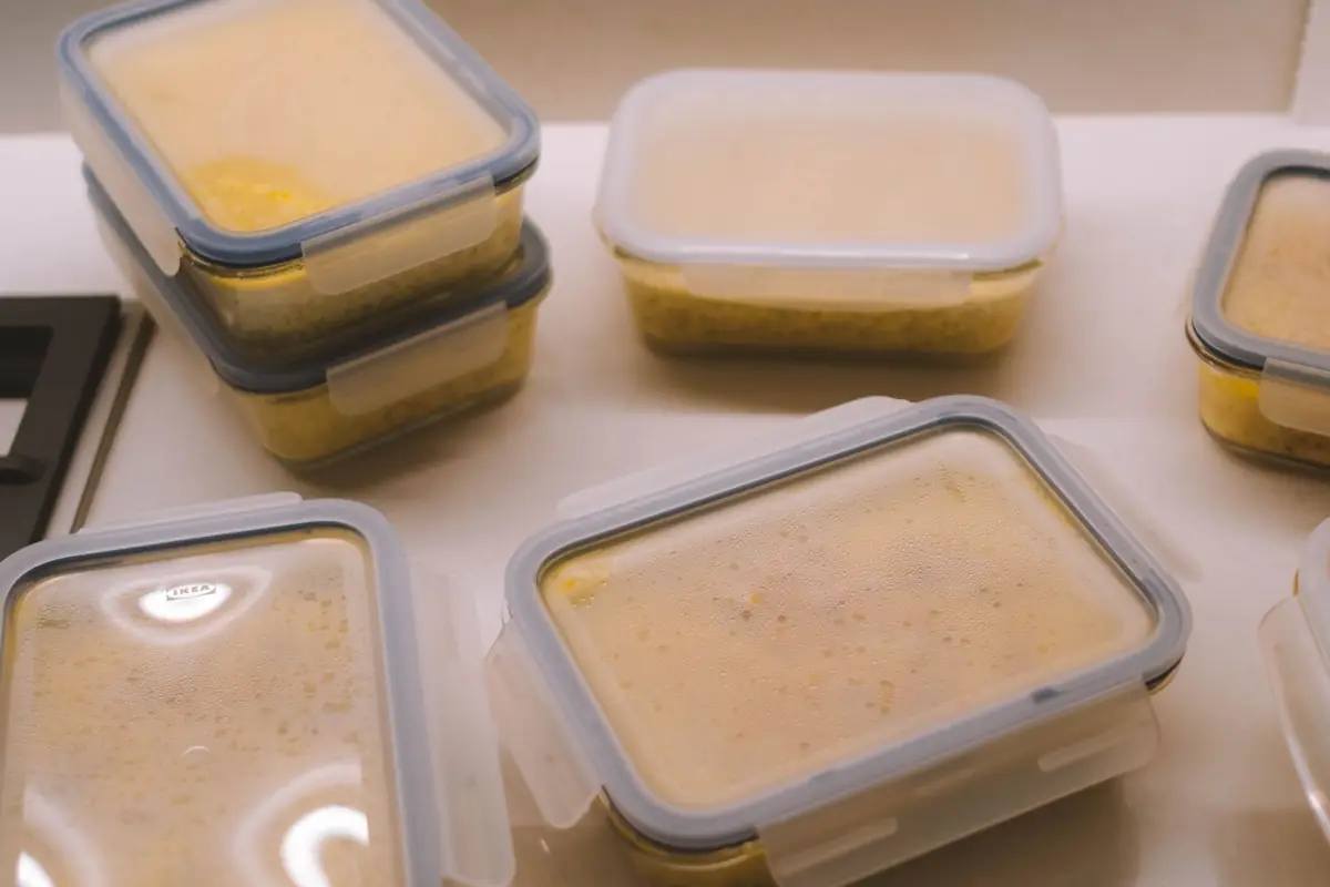Soup portioned into plastic containers for freezing
